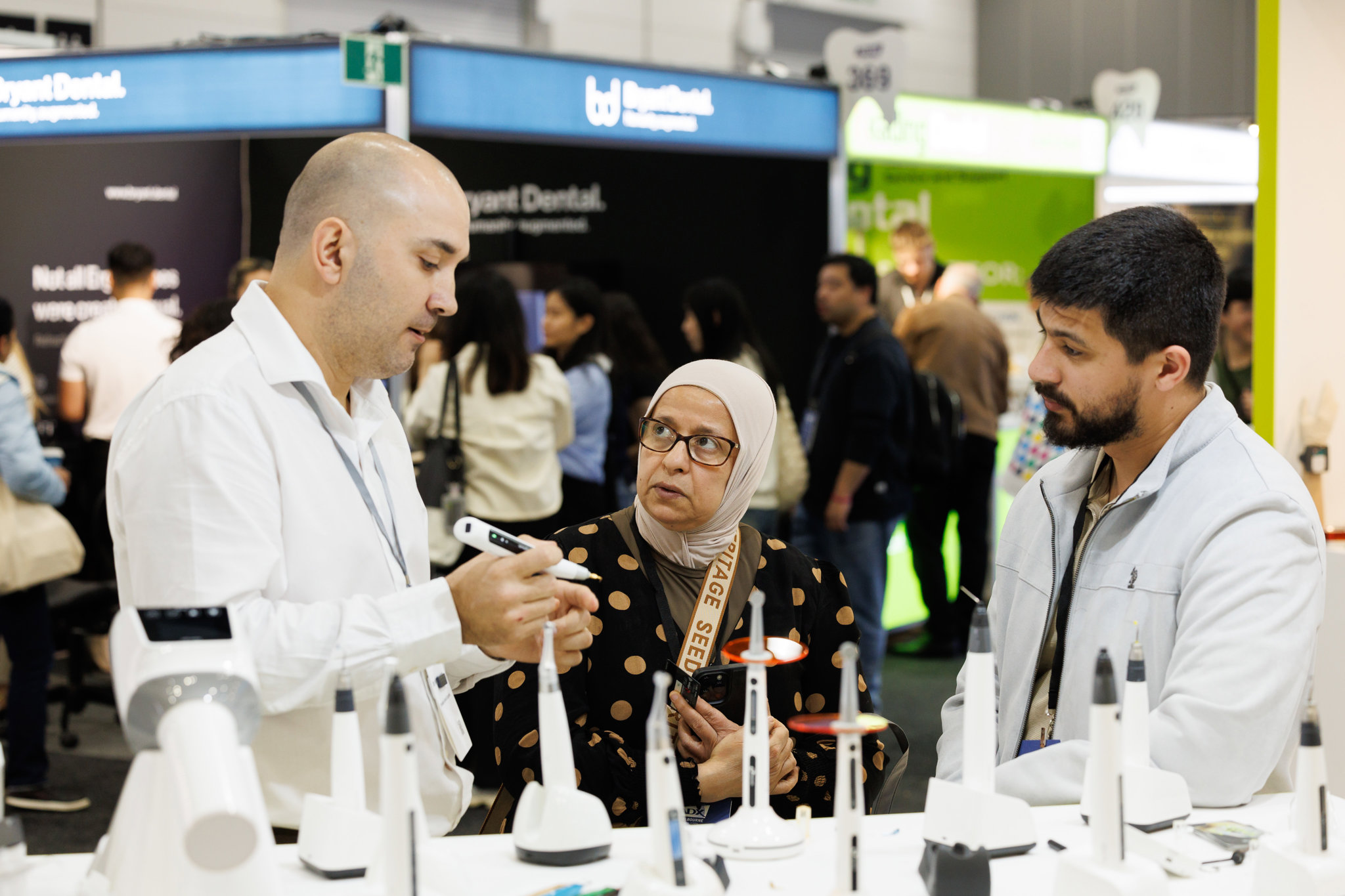 Dental suppliers connecting with attendees on the ADX exhibition floor