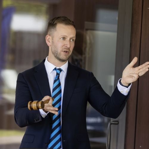 Nathan Gilbert - Harcourts logo